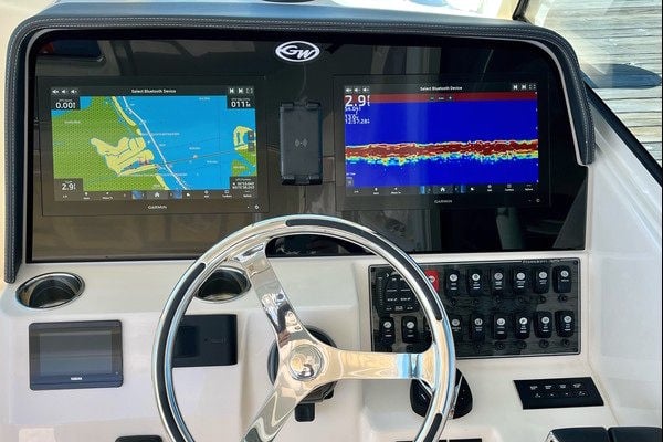 Awesome looking upgraded aftermarket dash panel on a Grady White Freedom 325