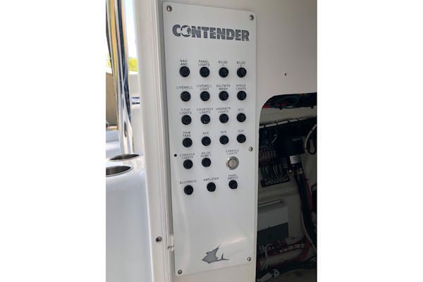 Custom breaker panel replacement installed on a Contender 24 center console