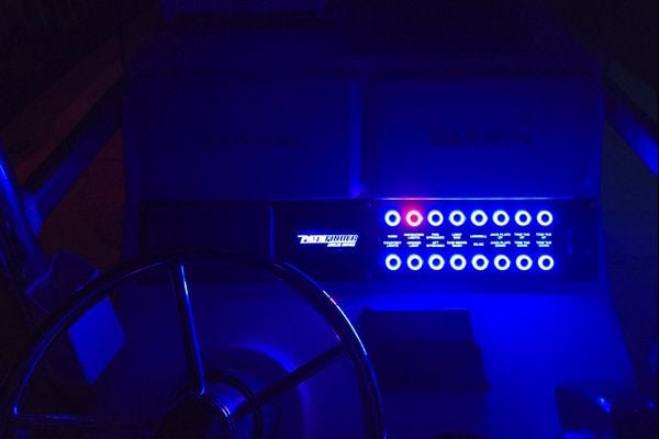 Night view of upgraded dash panel on a 2005 Pathfinder 2200V with blue LED backlit switch panel