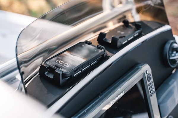 Custom helm topper on a 2008 Pathfinder 2200T with two wireless phone chargers
