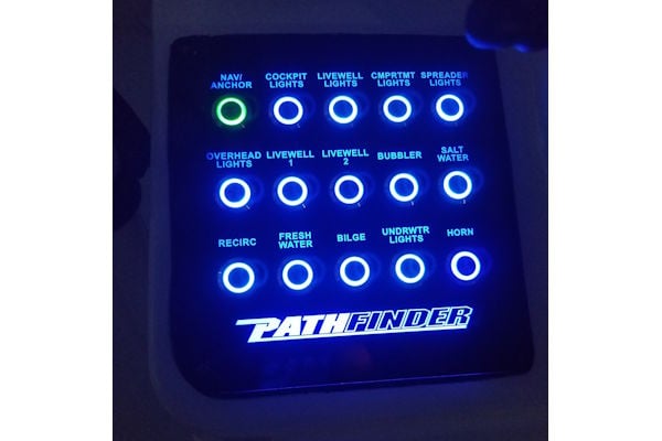 Custom Pathfinder push button switch panel with laser-etched labels and modern backlit controls