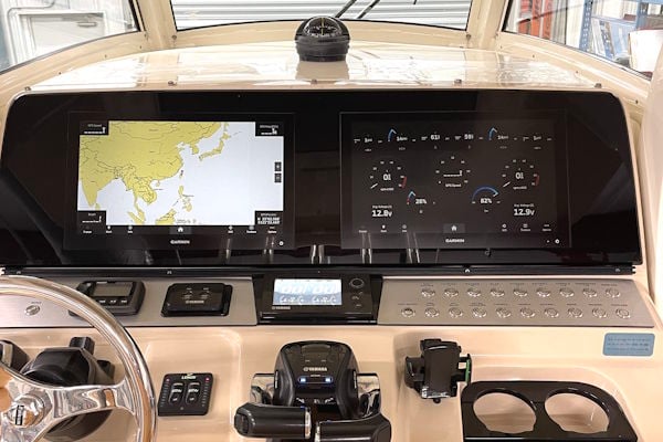 Custom dash panel on a 2015 Scout 300 LXF with dual multifunction displays and blackout helm design