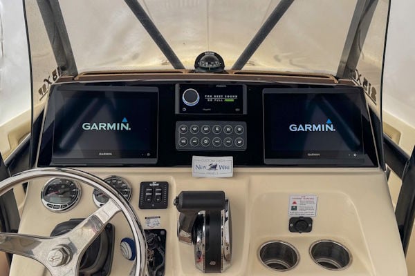 Scout 215 XSF dash panel modernization with dual Garmin displays and custom electronics layout