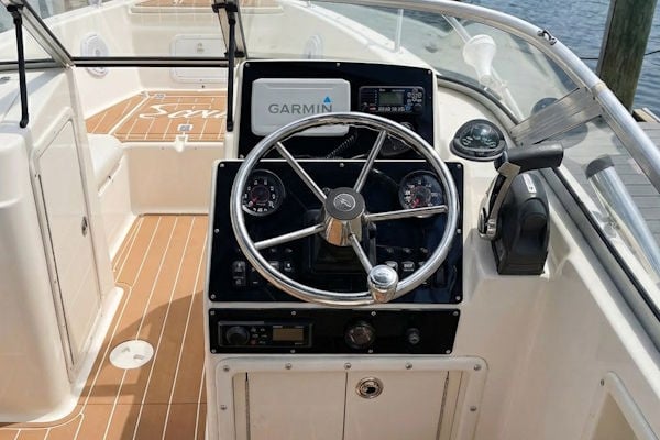 Scout center console helm with upgraded dash panel and flush-mounted Garmin multifunction display
