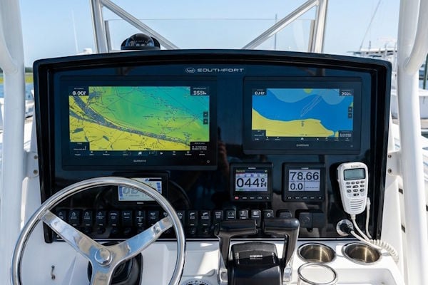 Southport helm modernization with dual MFD layout and custom dash panel replacement
