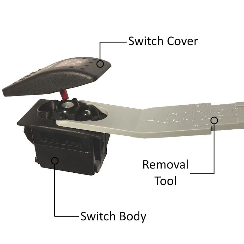 Marine rocker switch showing actuator removal tool separating switch cover from switch base