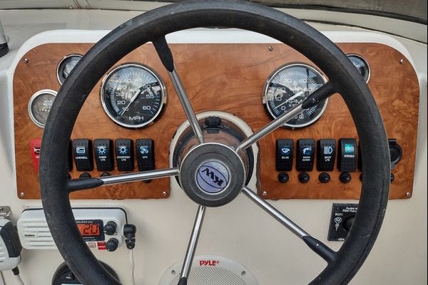 Custom replacement switch panel for a Key West 2020 WA — rocker switches with laser-etched labels, built by New Wire Marine