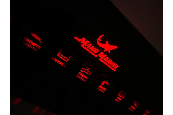 Mako switch panel with backlit logo and red rocker switches from New Wire Marine